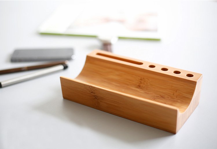 Empty bamboo desktop organizer with phone and pen slots — sustainable and stylish workspace accessory for minimalist office setups.