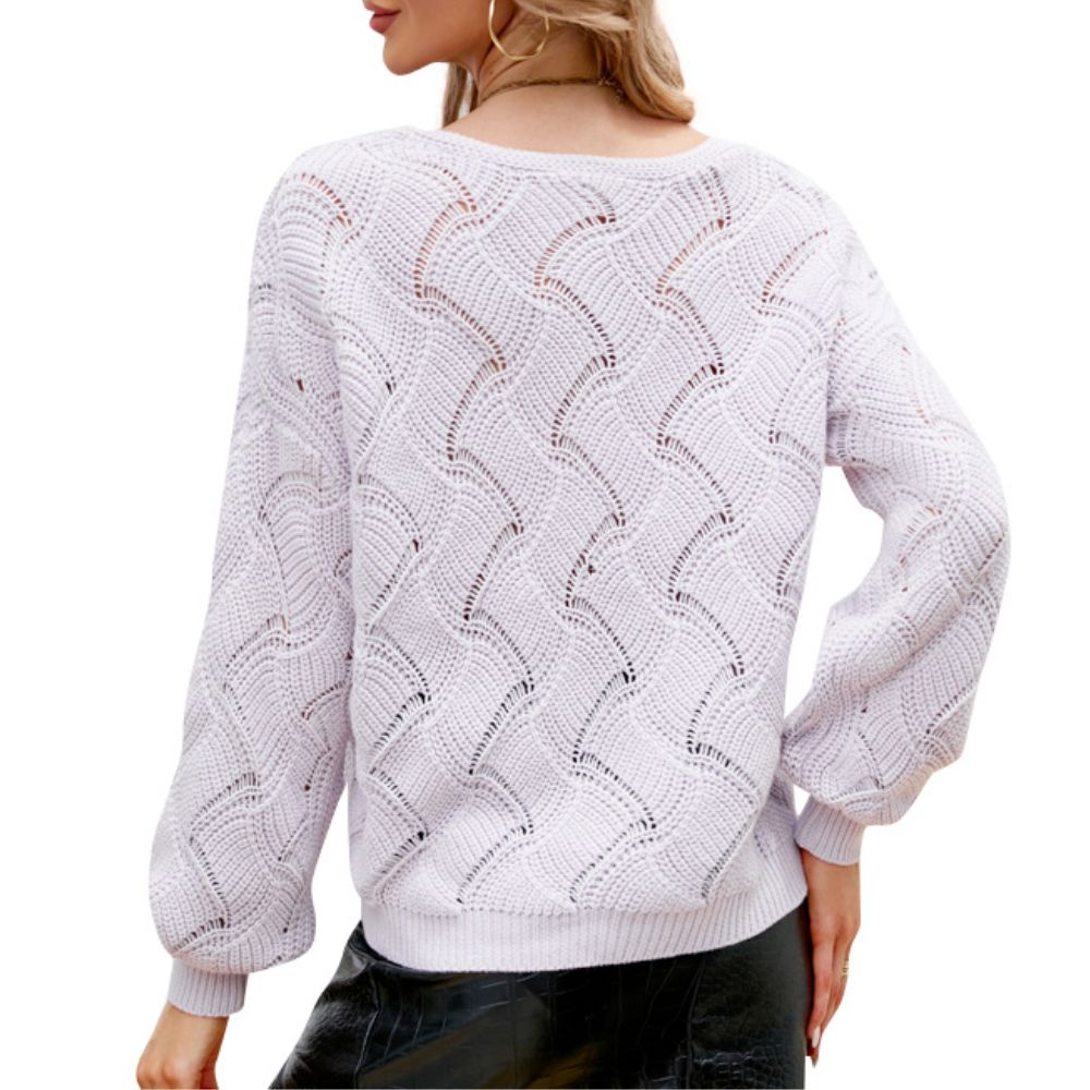 Rear view of a lilac knit sweater featuring a wave-textured open-stitch pattern and relaxed balloon sleeves, styled with a black faux leather skirt for a soft yet edgy look.