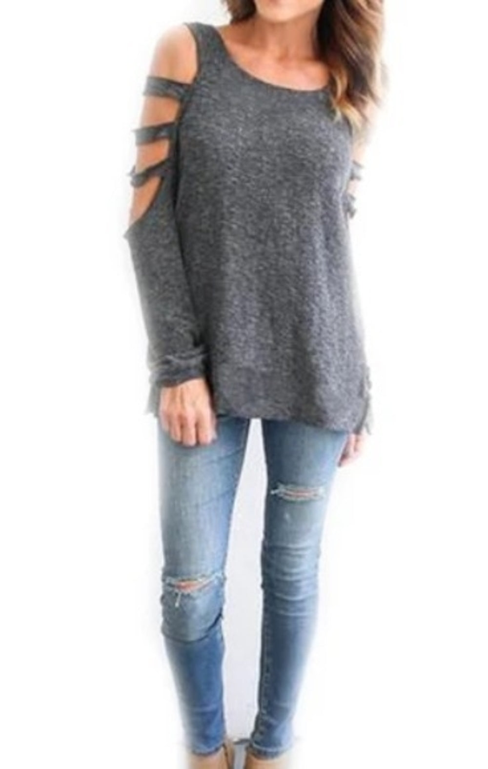Woman wearing a charcoal grey long sleeve top with triple cold shoulder strap accents, styled with distressed skinny jeans and neutral-toned shoes—perfect for a relaxed and edgy streetwear look.