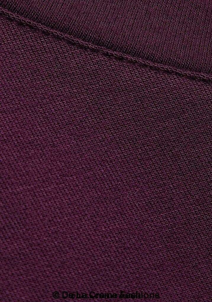 Detailed close-up of the plum long sleeve top fabric showing fine stitching and soft-knit texture, highlighting material quality from De La Creme Fashions.