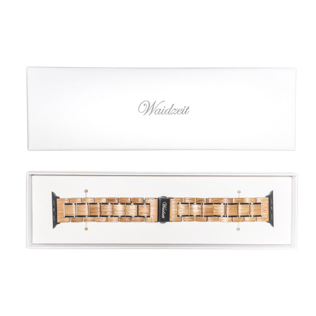 Waidzeit wooden Apple Watch strap made from reclaimed barrique wine barrels, presented in a premium white gift box with branded clasp.