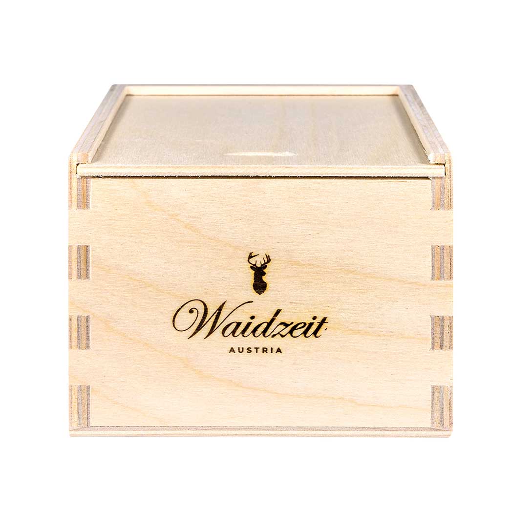 Waidzeit branded wooden watch box with engraved stag logo, handcrafted in Austria, ideal for luxury timepiece presentation and storage.