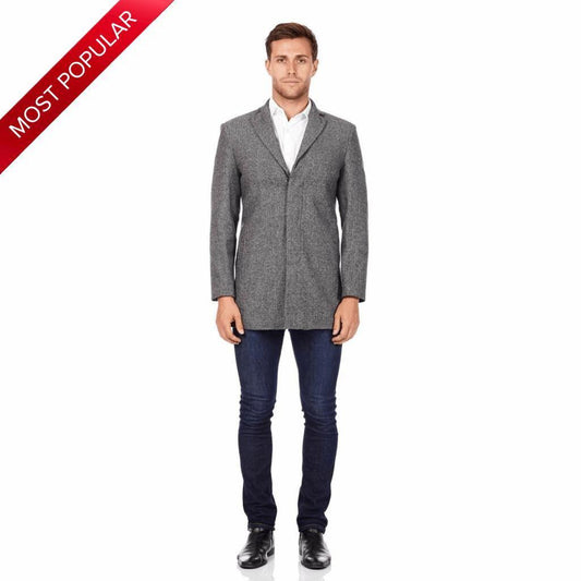 Man wearing a grey slim-fit wool blend overcoat with a single-breasted front, styled with a white shirt, dark jeans, and black leather shoes—highlighted as “Most Popular” for its modern classic appeal.
