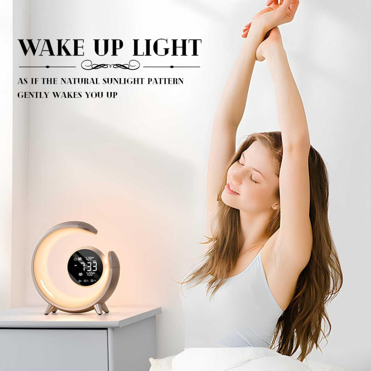 Woman waking up peacefully beside a crescent-shaped sunrise alarm clock with warm LED wake-up light that simulates natural sunlight for gentle morning routines