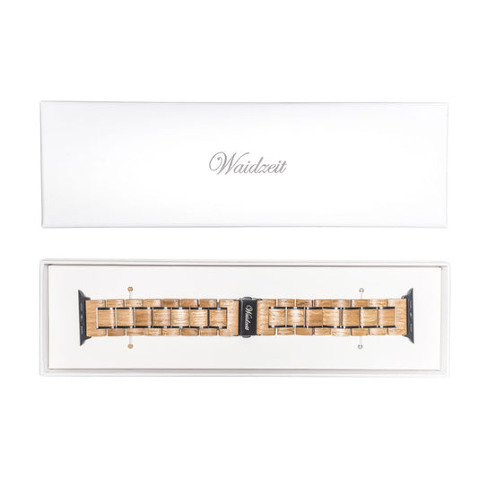 Waidzeit wooden Apple Watch strap made from reclaimed barrique wine barrels, presented in a premium white gift box with branded clasp.