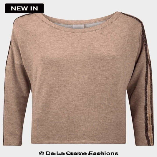 Front view of a taupe long sleeve women’s top featuring a relaxed fit and glitter-accented side stripe detail along the sleeves. Highlighted as “New In” from De La Creme Fashions.