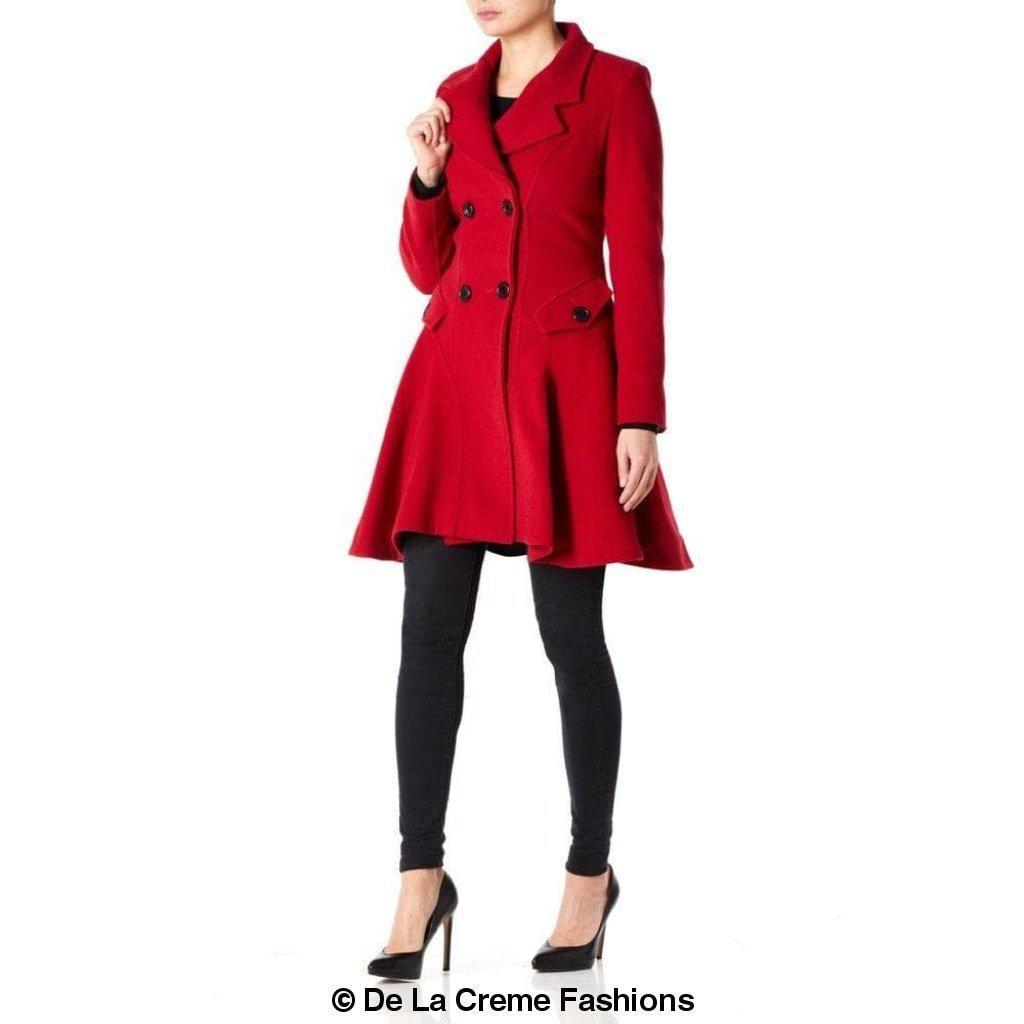Women's red fit and flare wool coat by De La Creme Fashions – double-breasted with wide lapels, tailored waist, and flared hem, modeled with black leggings and heels
