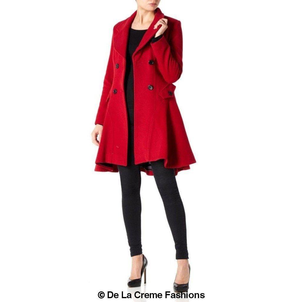 Elegant women's red wool blend coat by De La Creme Fashions – flared hem, double-breasted buttons, tailored fit with wide lapels, modeled with black outfit and heels