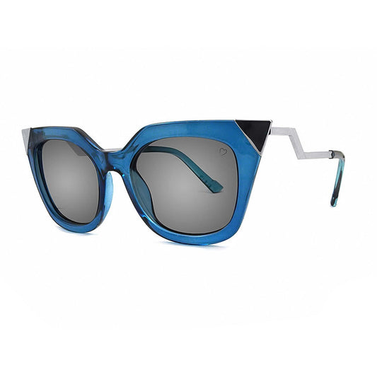 Bold blue geometric cat-eye sunglasses with metallic zigzag arms and grey lenses, futuristic designer eyewear for edgy fashion styling.